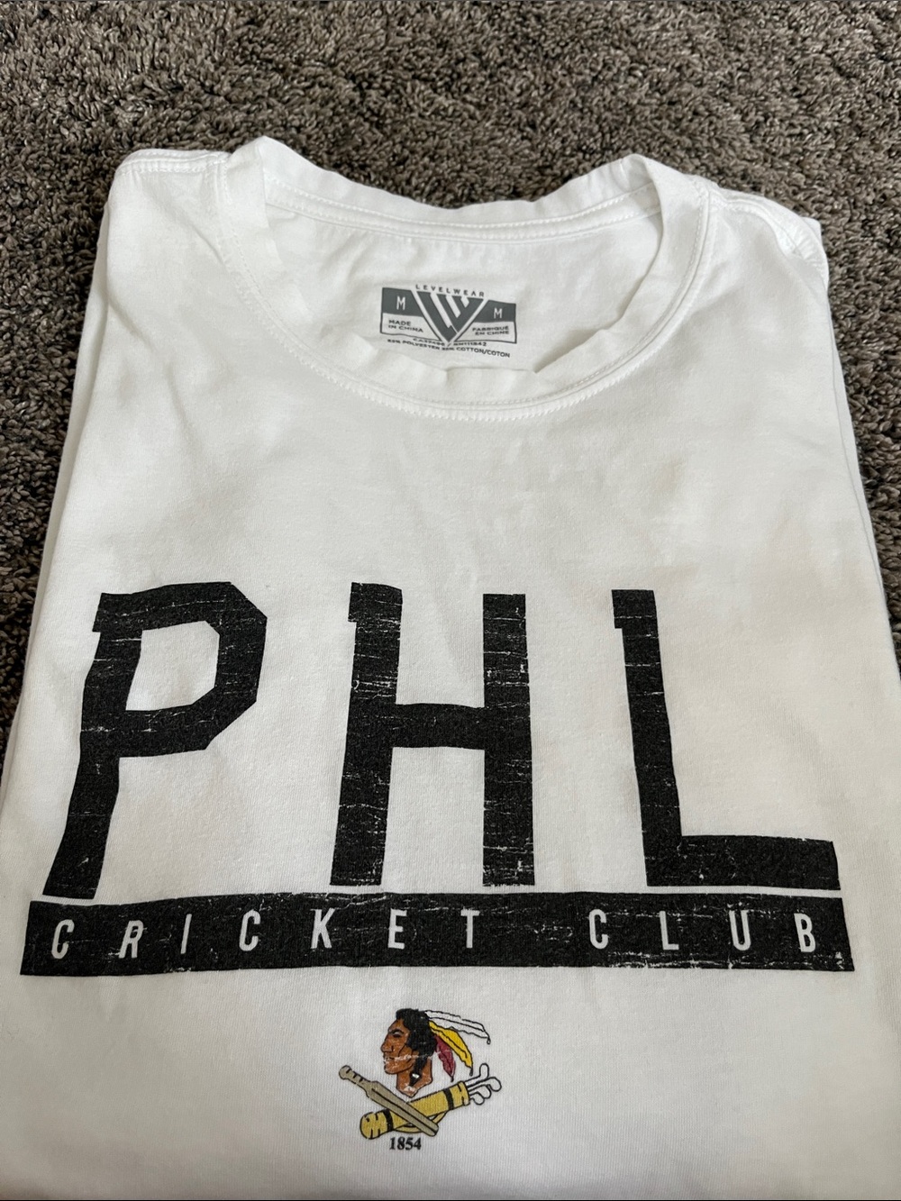 Level-wear White tee Shirt with PHL Cricket Club Logo. Good condition. Medium